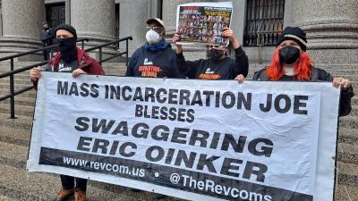 RevComs with banner "Mass Incarceration Joe Blesses Swaggering Eric Oinker."