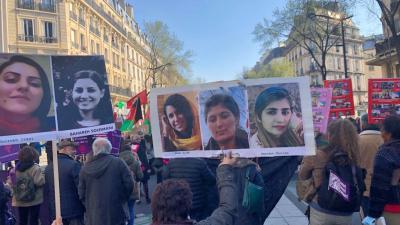 Paris International Women's Day posters of women demanding Free All Political Prisoners In Iran Now