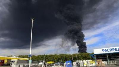 Smoke rises from the oil depot after missiles struck the facility in an area controlled by Russian-backed separatist forces in Makiivka, 15 km (94 miles) east of Donetsk, eastern Ukraine, Wednesday, May 4, 2022. 