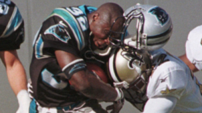1998, Carolina Panthers’ Fred Lane loses his helmet in a hard tackle.