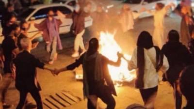 Iranian women without hijabs dance around a bonfire in Bandar Abbas, Hormozgan province, September 22, 2022.