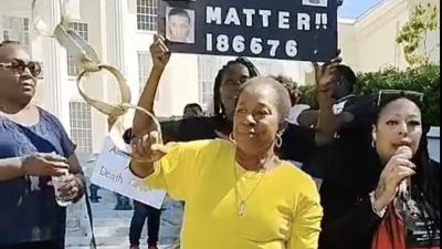Loved ones and supporters of Alabama prisoner's strike rally at Alabama State House.