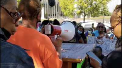September 26, 2022: A woman whose brother was one of three inmates to die from medical neglect in the last two months at the Bibb “Correctional Facility” speaks at a "Break All the Chains" rally outside the Alabama State House in Montgomery.