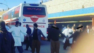 People making a human chain, surrounding an ambulance to prevent Iran’s security forces from using it to kidnap the wounded.