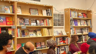 Andy Zee spoke at the holiday open house and fundraiser held at Revolution Books in NYC on December 11.