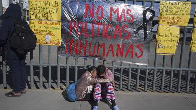 Venezuelan sisters outside immigration center where dozens of migrants were killed in fire.