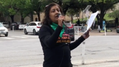 Coco Das speaking at Austin protest, April 8.