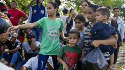 Migrant asylum seekers on the Mexican side of the Rio Grande river bank waiting to cross to the U.S. before Title 42 ends, May 10, 2023.
