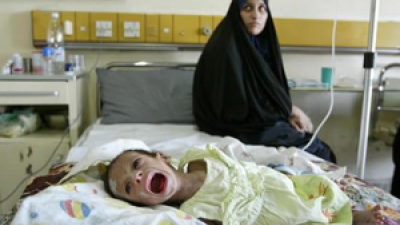 Child being treated for diarrhea in Baghdad, Iraq, 2004.