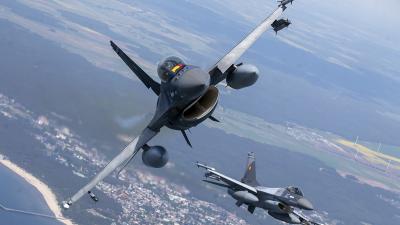 F-16 military fighter jets over Baltic Sea, for Ukraine.