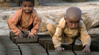 Two very young child laborers in a brick factory
