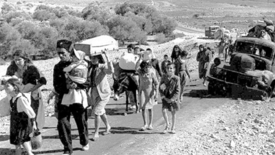 Palestinian refugees flee in 1948.