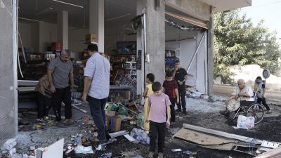 Palestinians look at the damage after an Israeli army raid on Jenin, West Bank, Friday, Nov. 3, 2023.