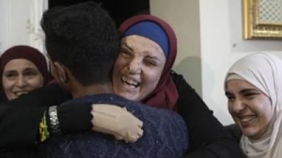Released Palestinian prisoner embraced by family and friends