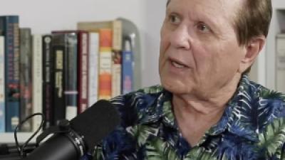 Headshot of Bob Avakian being interviewed