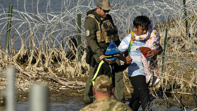Migrants crossing the border at Eagle Pass, Texas are taken into custody by the officials, January 3, 2024.