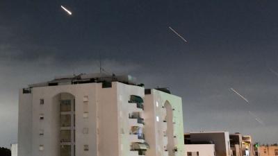 Israeli Iron Dome air defense system launches to intercept missiles fired from Iran, in central Israel, April 14, 2024.