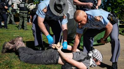 Georgia State Patrol detain a protester at a Pro-Palestinian protest at Emory University, April 25, 2024.