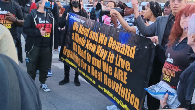 On April 11 in Chicago the Revcom Corps for the Emancipation of Humanity joined the protest of the murder of Dexter Reed.
