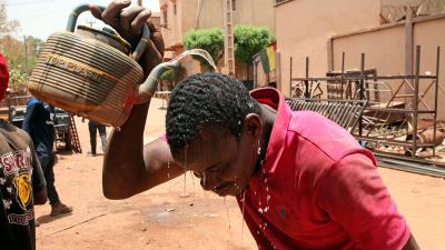 In the African country of Mali, one city reached 119 degrees, which may be the highest temperature ever recorded in Africa. This level of heat is deadly. People's liver and kidneys fail, and their brains swell. Here a welder, cools off with water in Bamako, Mali, April, 18, 2024. 