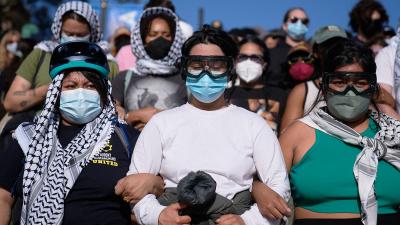 Pro-Palestinian demonstrators form a human chain on the UCLA campus, Los Angeles, May 1, 2024.