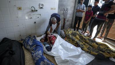 Checking bodies from Israeli bombardment of Gaza Strip at a hospital morgue in Deir al-Balah, July 13, 2024