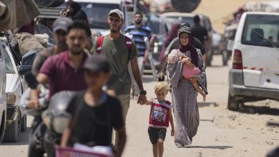 Palestinians displaced by the Israeli air and ground offensive on the Gaza Strip flee from parts of Khan Younis, July 27, 2024.