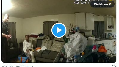 Sonya Massey in her home with cop standing near.