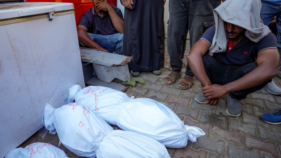 Palestinians at a hospital in central Gaza mourn relatives killed in Israeli bombardment, July 18, 2024.