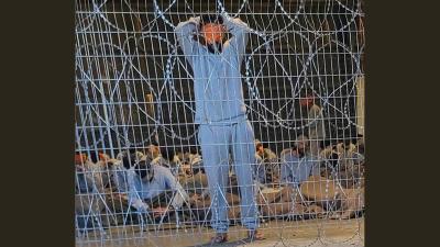 Blindfolded Palestinian prisoners captured in Gaza by Israeli forces, at the Sde Teiman military base in southern Israel, winter 2023. (Photo: breakingthesilence.org.il)