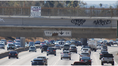 Banner for @BobAvakianOfficial hanging on LA Freeway, September 20, 2024.