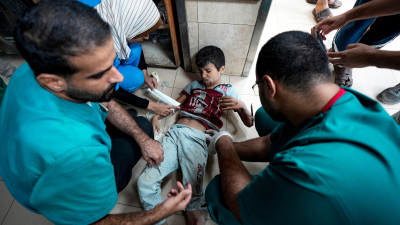 Doctors at Deir al-Balah treat a child wounded in the Israeli bombardment of the Gaza Strip, September 29, 2024.