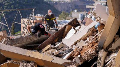 Searching for victims in a residential building destroyed by an Israeli airstrike in Barja, Lebanon, November 6, 2024.