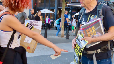 Woman interested in poster “No Election Can Legitimize Fascism”