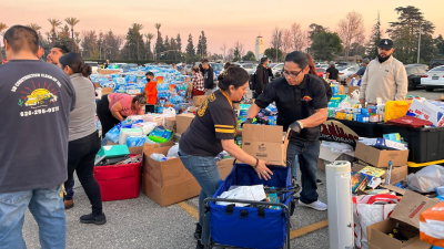 The grassroots donation center at Santa Anita Park grew overnight to thousands of people bringing donations and volunteering to help.