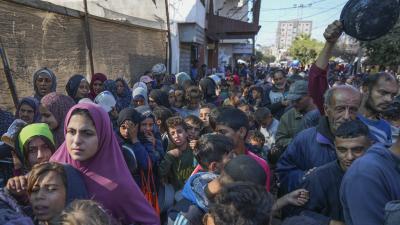 Palestinians queue for food in Deir al-Balah, Gaza Strip, November 18, 2024.