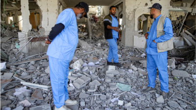 Medics inspect ruins of Al Najjar hospital destroyed by Israeli airstrikes, January 19, 2025