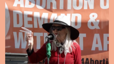 Carol speaking at an abortion rights rally, downtown Los Angeles on International Women’s Day, March 8, 2022
