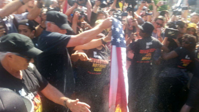 Joey Johnson burning flag iat the Republican National Convention, Cleveland, July 20, 2016.