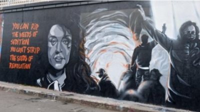 Part of a mural on a Paris street featuring Narges Mohammadi and scenes from the Woman, Life, Freedom uprising of 2022. (IG: @claks_one)