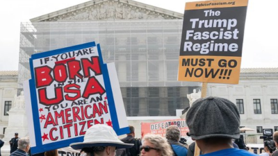 Protest signs at Supreme Court