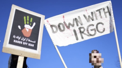 Sign carried in a protest of Iran war, Berlin, March 7, 2026