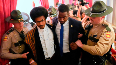 Rep. Justin J. Pearson, D-Memphis, second from left, with his brother KeShaun Pearson, as he is arrested in the House gallery, May 7, 2026.