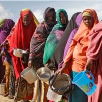 Climate refugees lined up for water