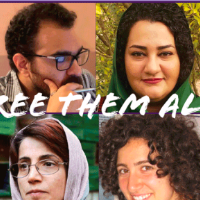 "Free them all" with pictures of Iranian political prisoners