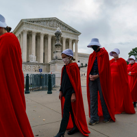 Protesters in Handmaids costumes outside the Supreme Court