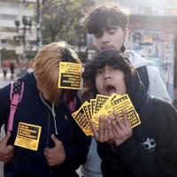 Skater kids take Forced Motherhood is Female Enslavement stickers to put up everywhere