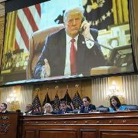 January 6 hearing with projection of Trump