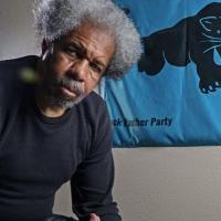 Albert Woodfox with Black Panther Party banner