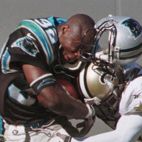 1998, Carolina Panthers’ Fred Lane loses his helmet in a hard tackle.